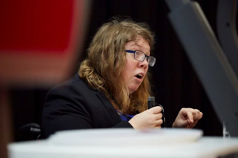 Women presenting at a conference