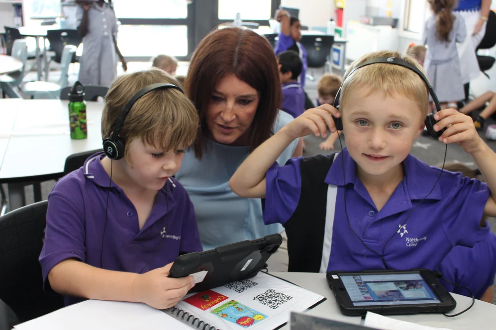 Janet Williamson teaching two young children