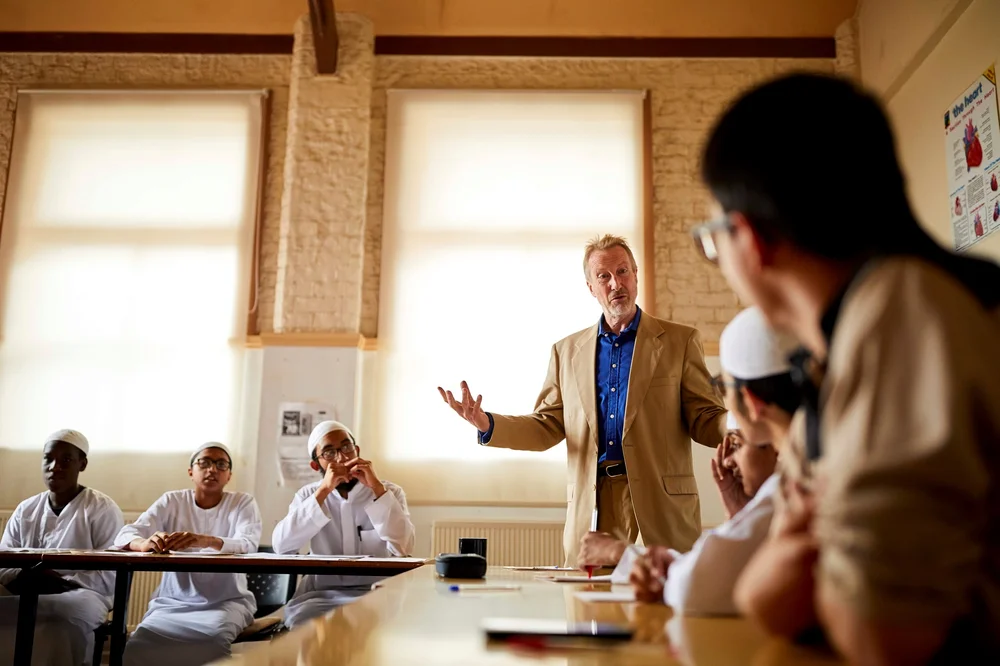 Michael Davies teaching a group of students
