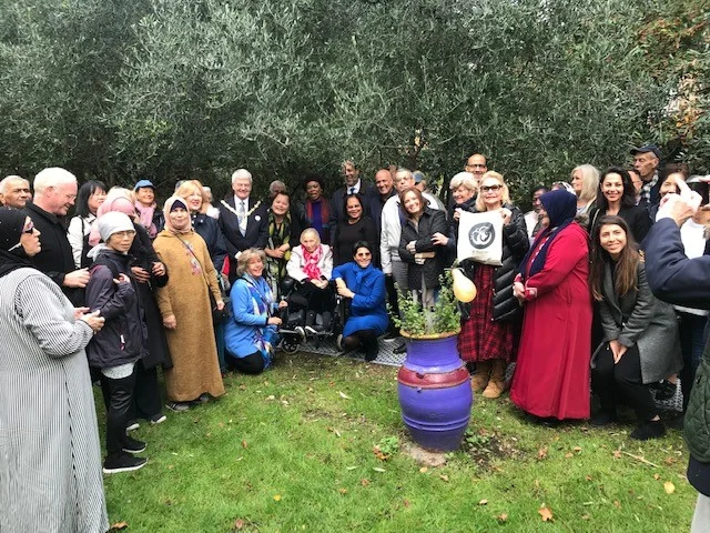 A group photograph of women and staff at the Al-Hasaniya Moroccan Women’s Centre